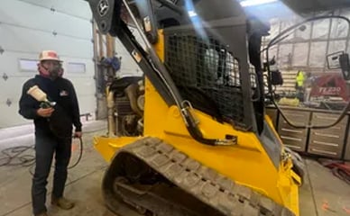 Painting a skid steer