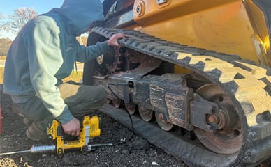 Service employee working on Undercarriage Refurbishment